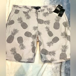 Travis Matthew’s light weight gray golf shorts with pineapples. NWT size 38.